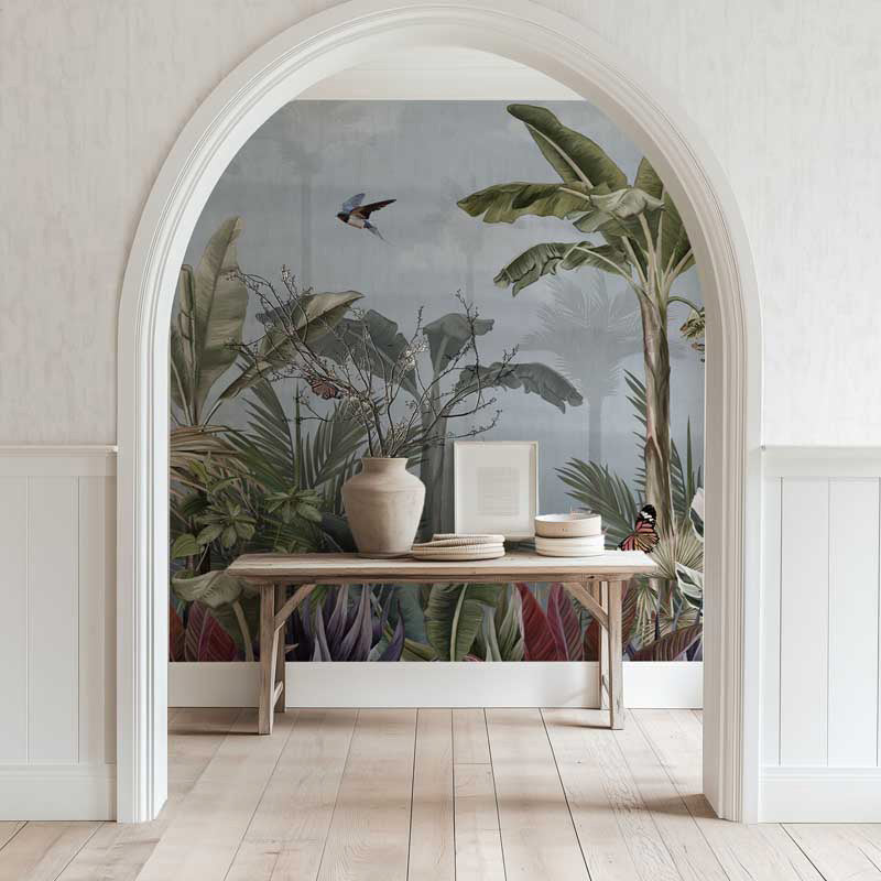 Room with a nature wall mural featuring plants and a table with items.