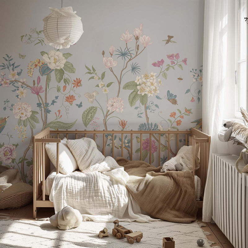 Nursery room with floral wallpaper, wooden crib, and toys on a light wooden floor.