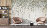 Modern living room with two brown armchairs, a small round table, and a decorative leaf wall wallpaper mural.