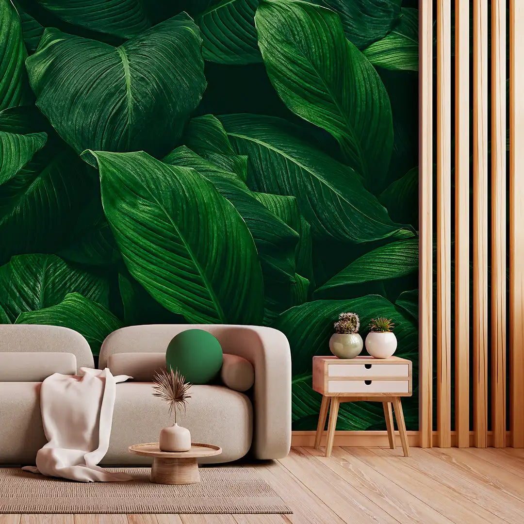 Modern living room with a large green leafy wall mural.