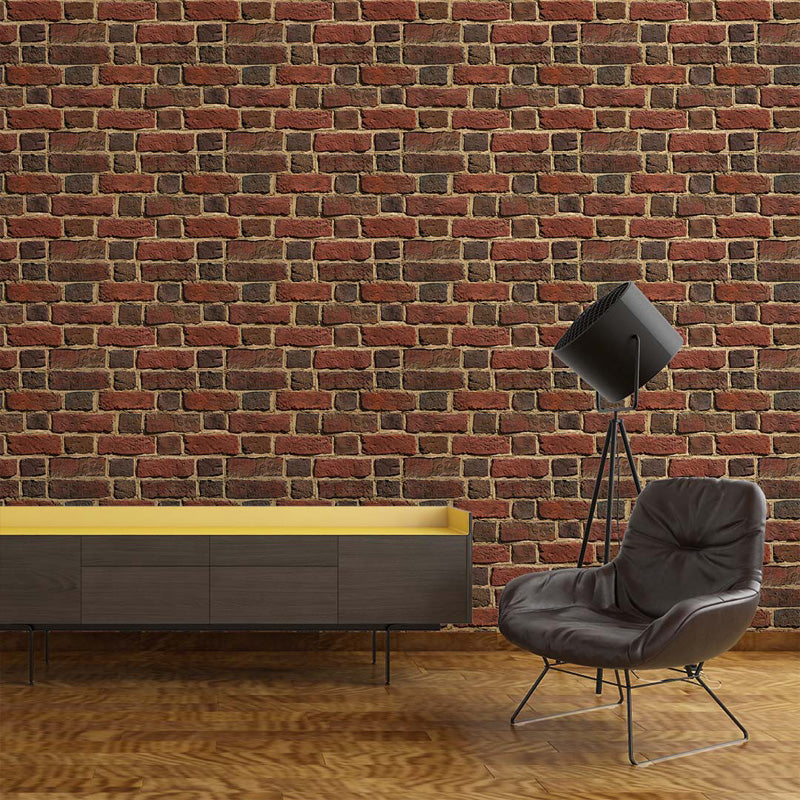 Modern interior with a brick wallpaper, gray chair, and yellow cabinet.