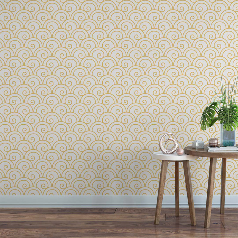 Room interior with a geometric wallpaper and wooden furniture.