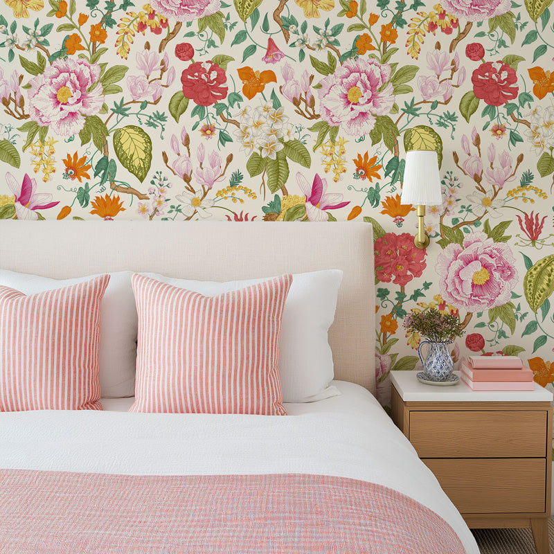 Bedroom with floral wallpaper, pink and white bedding, and a nightstand.