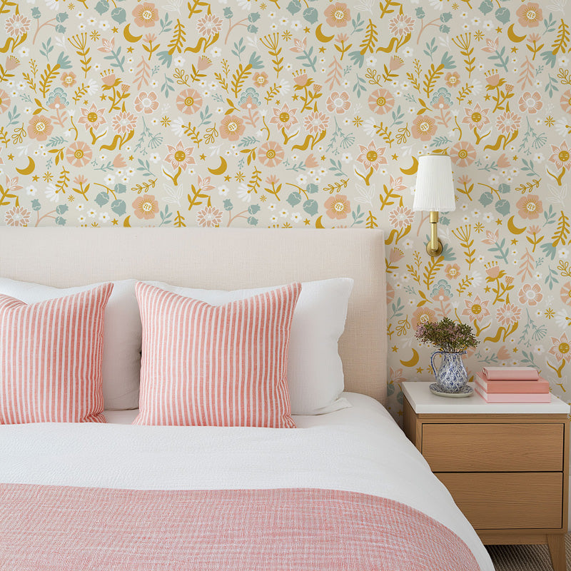 Bedroom with floral wallpaper, pink striped pillows, and a wooden nightstand.