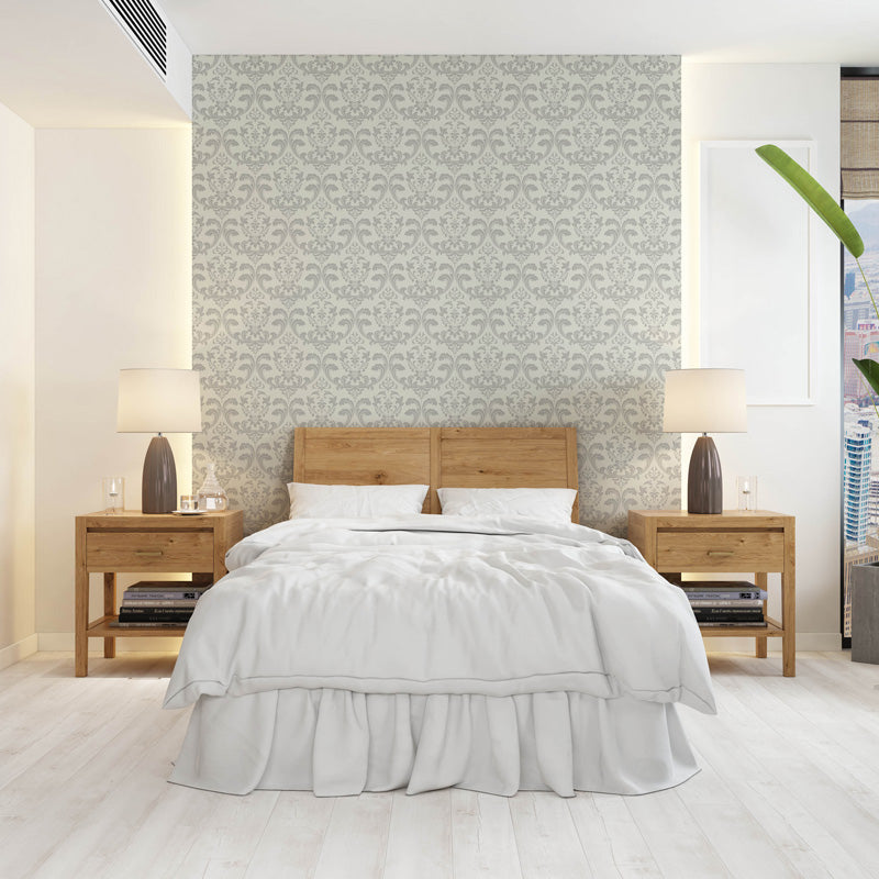 Modern bedroom with wooden bed and nightstands against a white classic wallpaper.