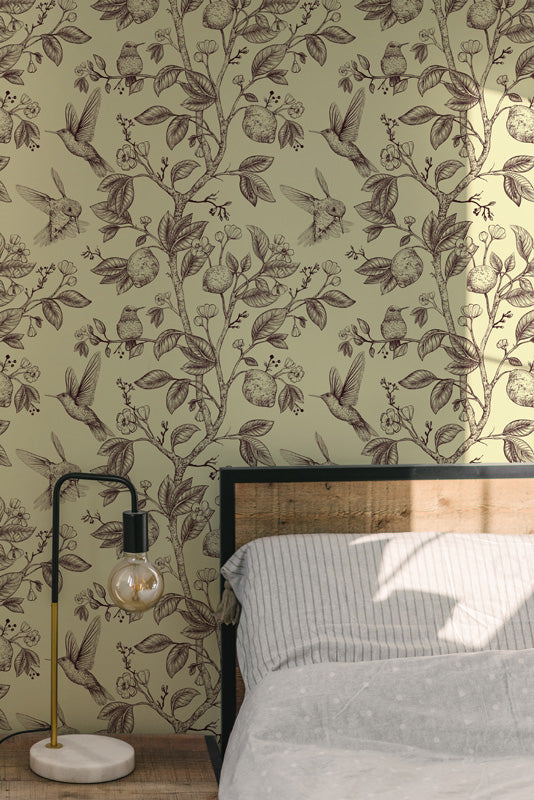 Bedroom with floral wallpaper, bed, and lamp