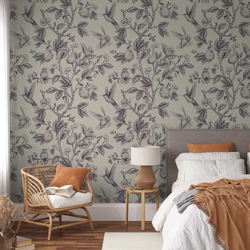 Bedroom with floral wallpaper, chair, and bed with brown and white bedding.