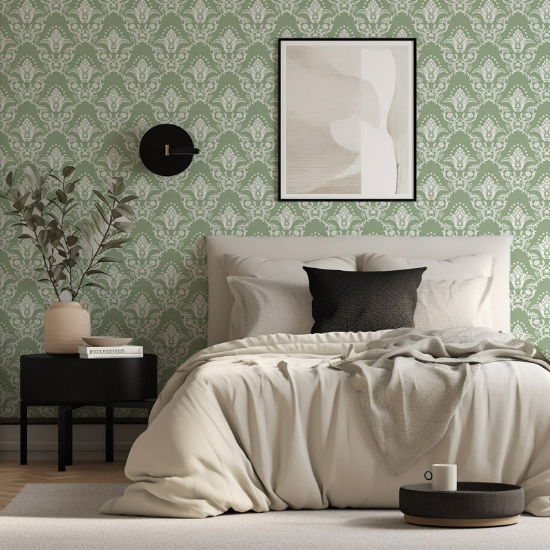 Modern bedroom with green wallpaper, bed with white bedding, and side table.
