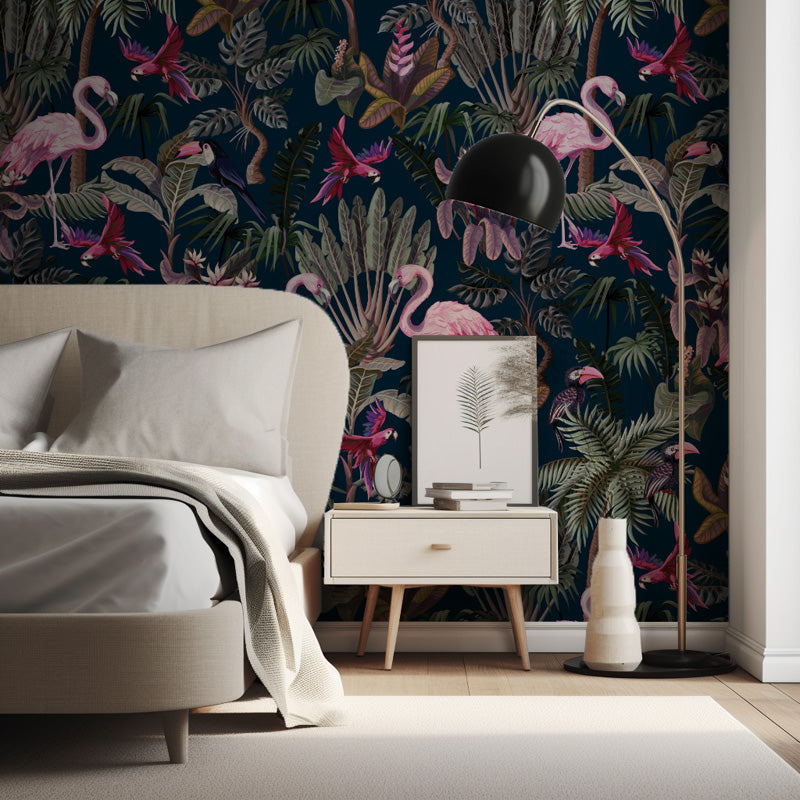 Modern bedroom with flamingo and floral wallpaper, bed, nightstand, and lamp.