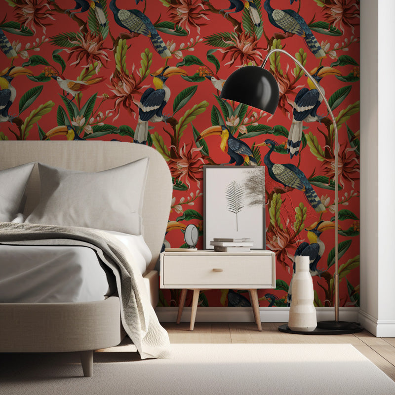 Modern bedroom with vibrant floral and bird wallpaper, bed, nightstand, and floor lamp.