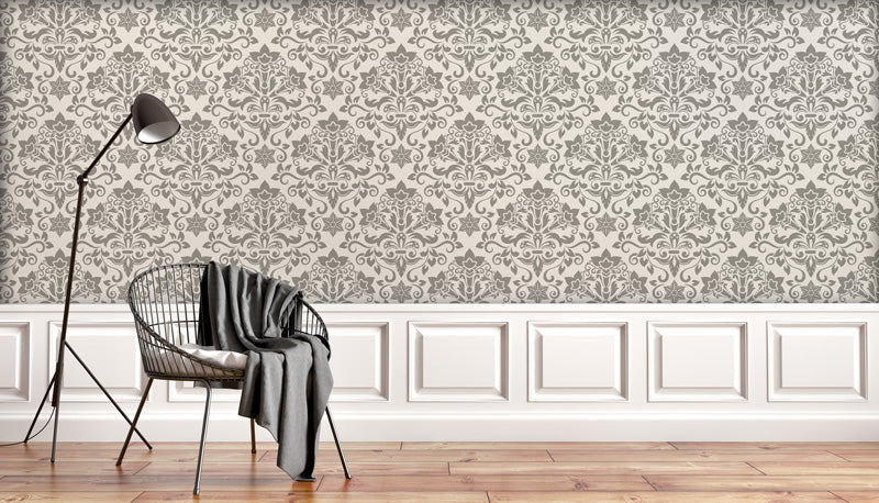 Living room with vintage wallpaper, chair, and lamp.