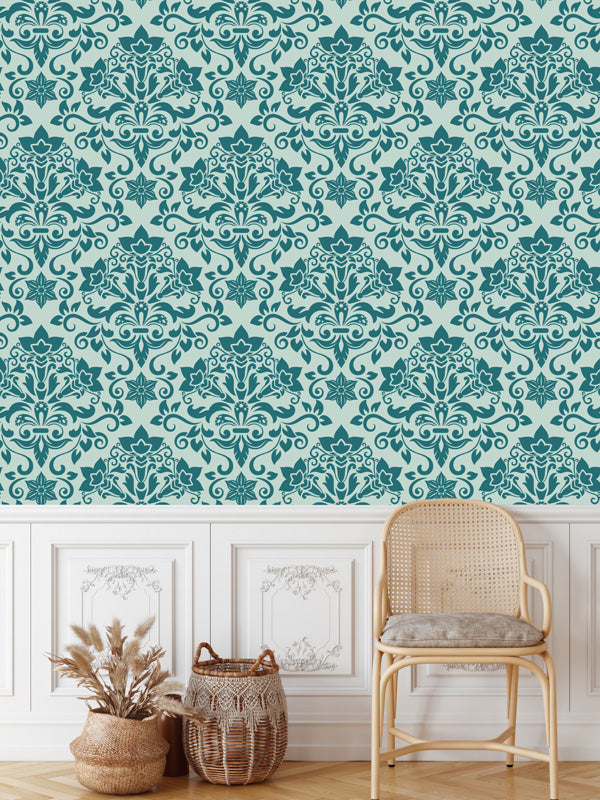 Teal damask wallpaper with a chair, baskets, and plant on a light background