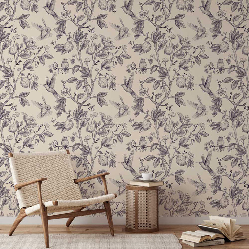 Floral wallpaper pattern in a room with a chair and books.
