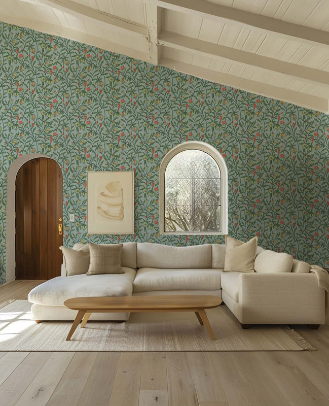 Living room with floral wallpaper, beige sofa, and wooden coffee table.