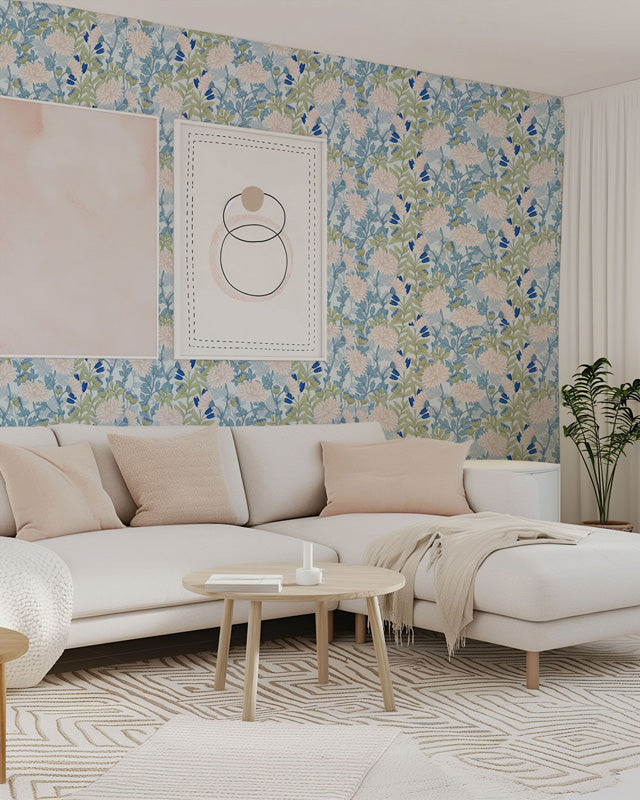 Living room with floral wallpaper, beige sofa, and decorative elements.