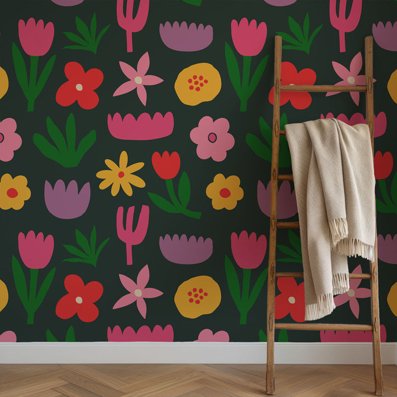 Colorful floral wallpaper with a wooden ladder and beige blanket.