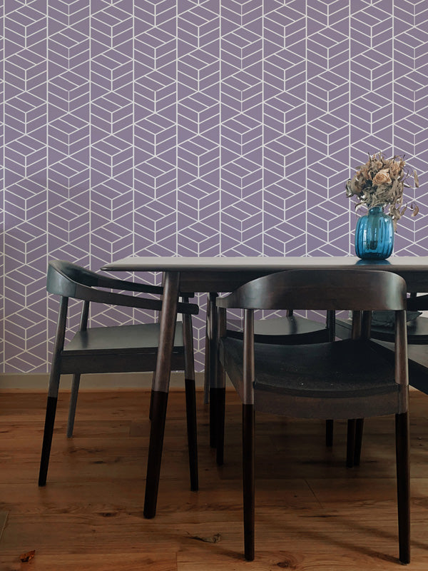 Dining area with a geometric wallpaper, table, and chairs.
