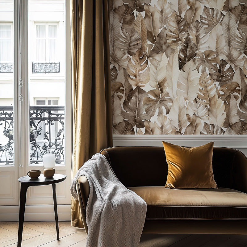 Living room with a brown sofa, gold pillow, and leaf classic wallpaper.