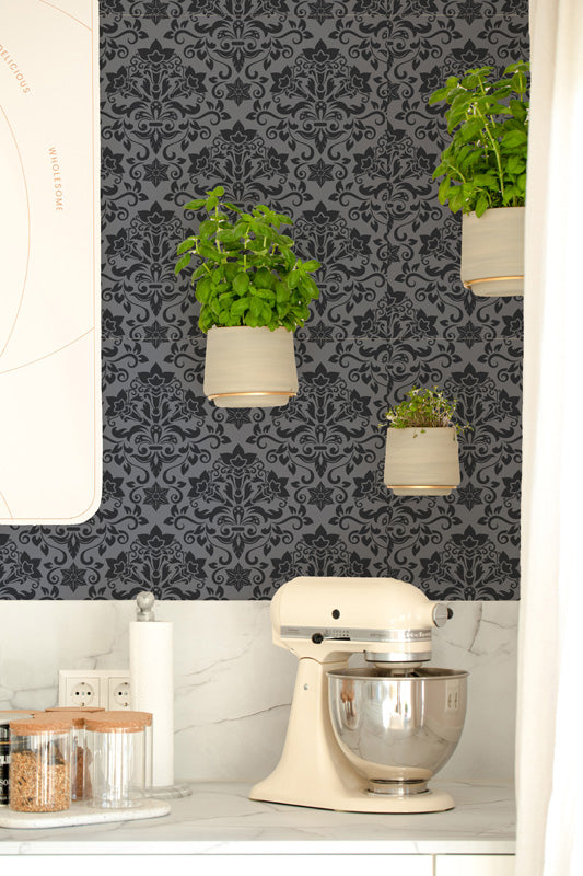 Kitchen scene with a stand mixer, potted plants, and decorative dark wallpaper.