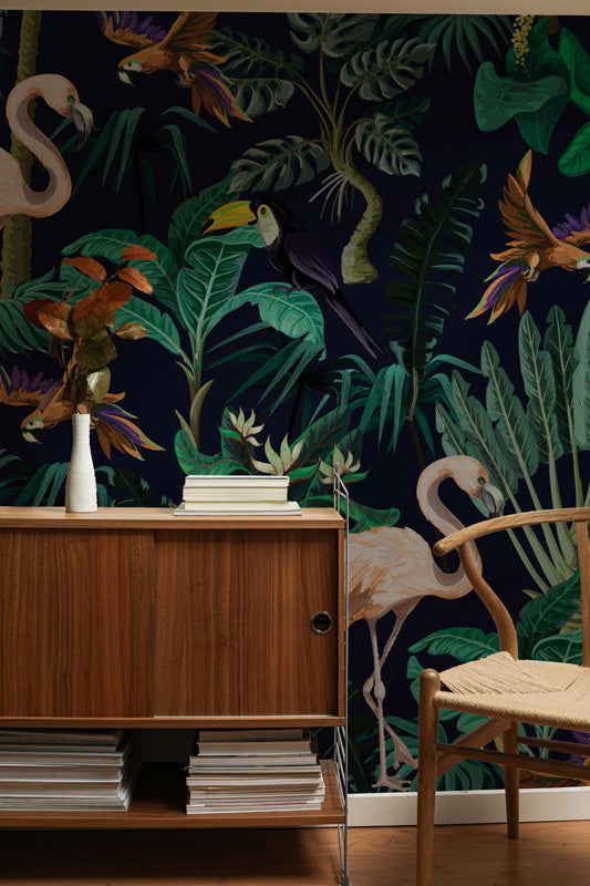 Room interior with wooden sideboard, chair, and decorative wallpaper featuring tropical wallpaper.