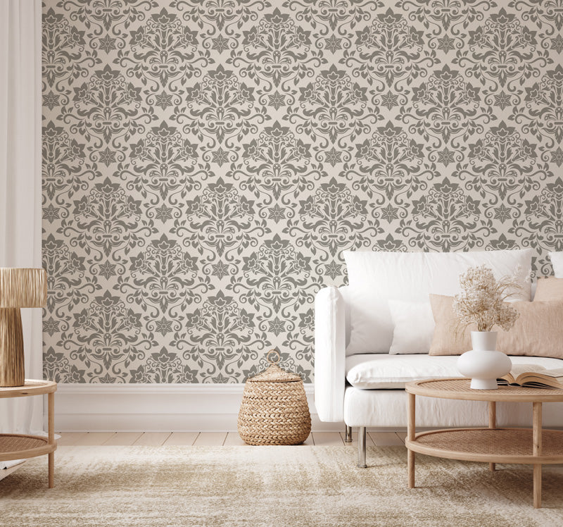 Living room with vintage wallpaper, white sofa, and wooden furniture.