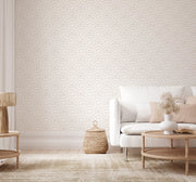 Living room with geometric wallpaper, white sofa, and wooden coffee table.