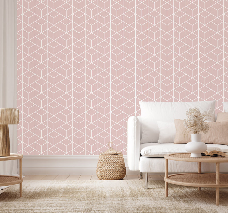 Living room with pink geometric wallpaper, white sofa, and wooden coffee table.