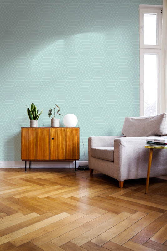 Living room with wooden floor, light blue wallpaper, and furniture.