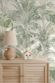 Tropical leaf wallpaper with a wooden cabinet and lamp