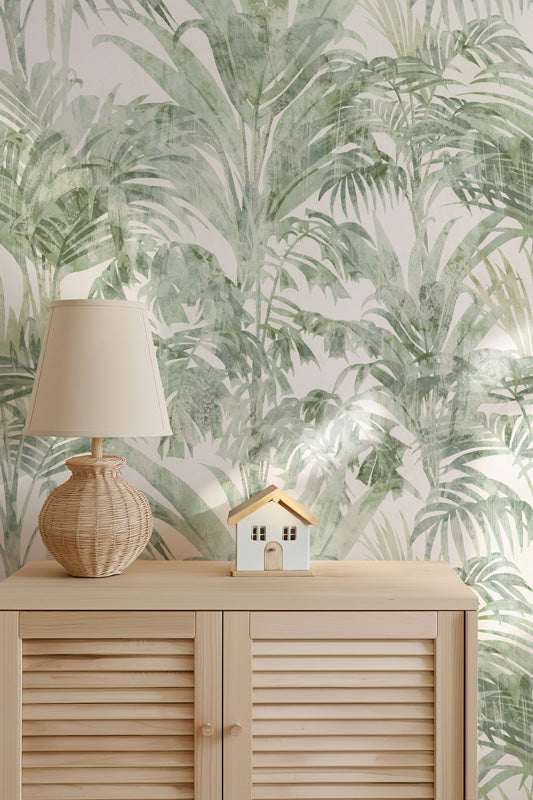 Tropical leaf wallpaper with a wooden cabinet and lamp