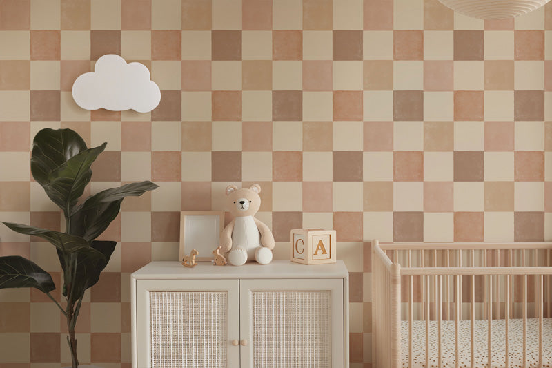 Nursery room with checkered wallpaper, teddy bear, and crib.