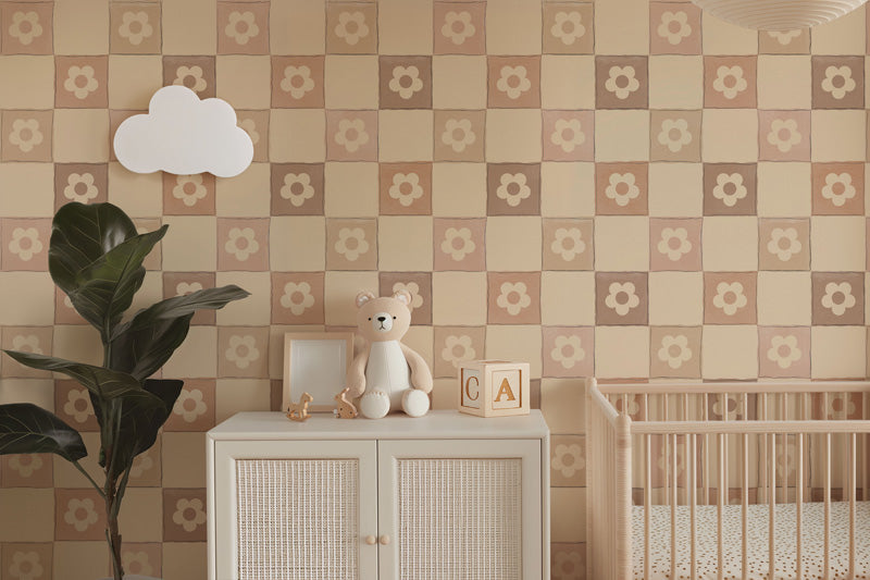 Nursery room with checkered wallpaper, cabinet, teddy bear, and crib.