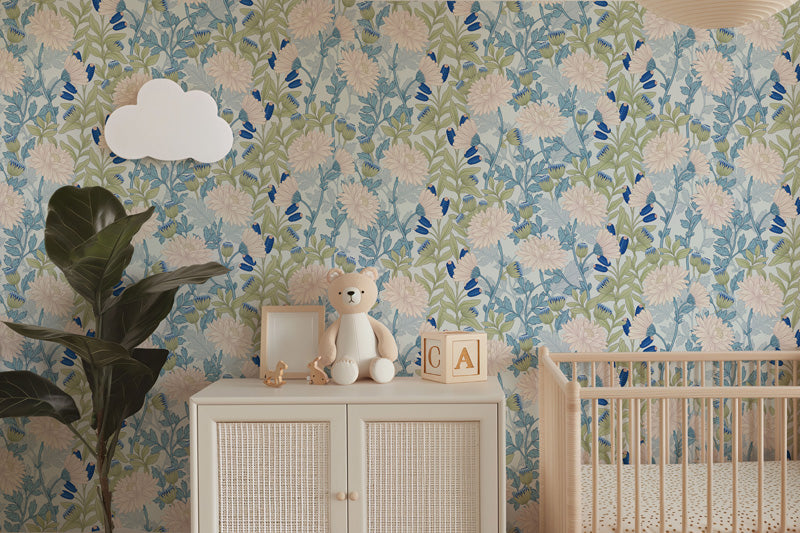 Children's room with floral wallpaper, a teddy bear, and a crib.