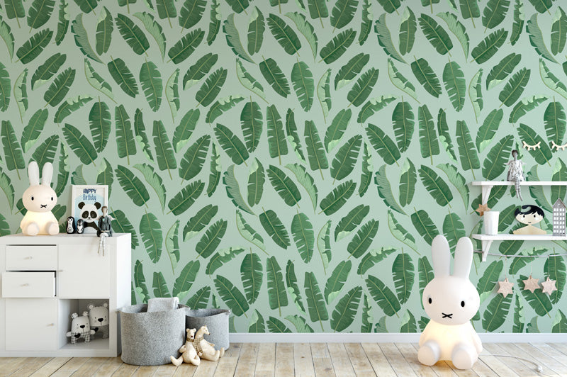 Children's room with green wallpaper and toys on shelves.