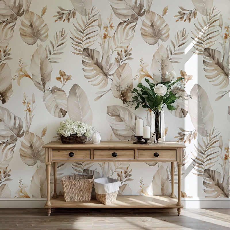 Wooden console table with decorative items against a leaf wallpaper.
