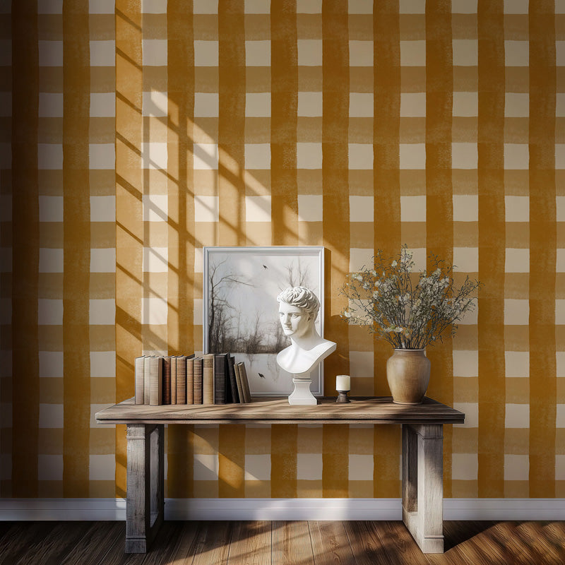 Room interior with a wooden table against a yellow and white checkered wallpaper.