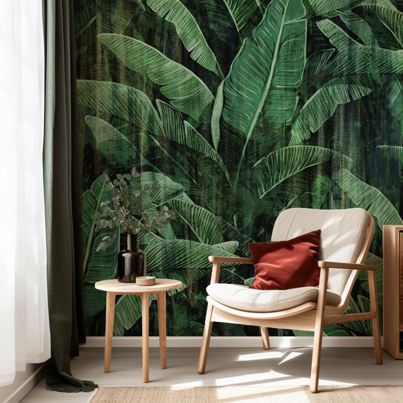 Modern interior with a chair, side table, and decorative items against a tropical leaf wallpaper.