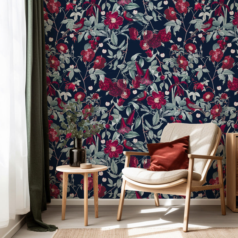 Living room with floral wallpaper, chair, and side table.