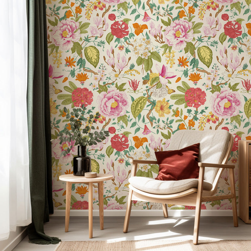 Room interior with a chair, small table, and colorful floral wallpaper.