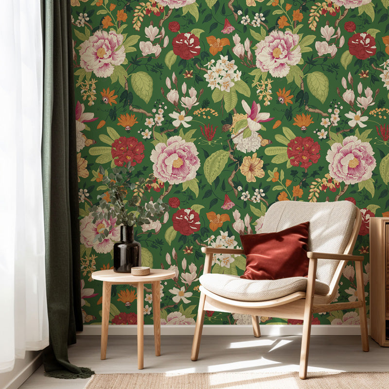 Room interior with floral wallpaper, chair, and small table.