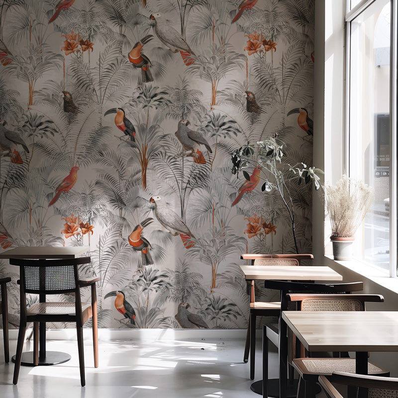Restaurant interior with bird wallpaper and wooden tables.
