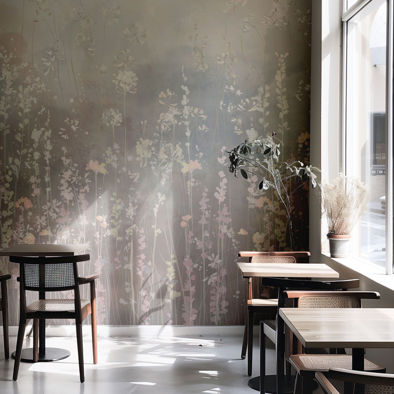 Modern interior with floral wallpaper, tables, and chairs.