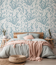 Bedroom with coral wallpaper, wooden bed, and pink blanket.
