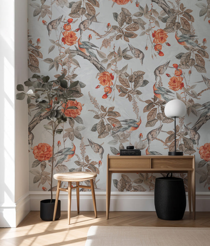 Room interior with floral wallpaper, wooden desk, and decorative items.