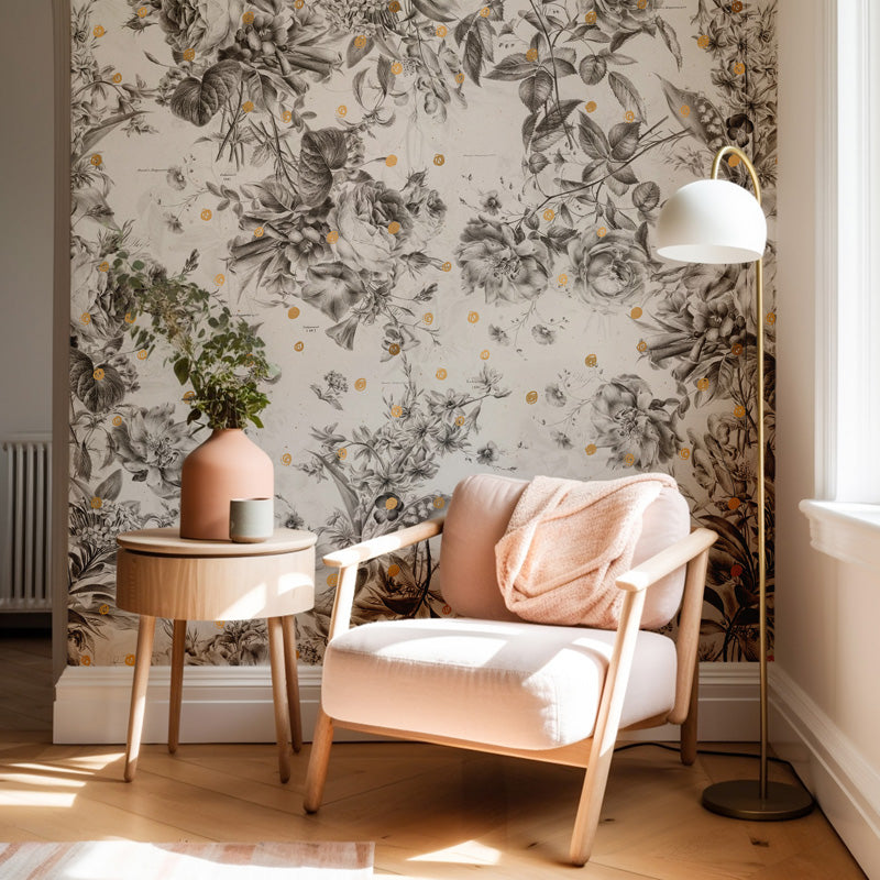 Cozy corner with a floral wallpaper wall, armchair, side table, and lamp.