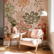 Cozy corner with a floral wallpaper, armchair, side table, and lamp.