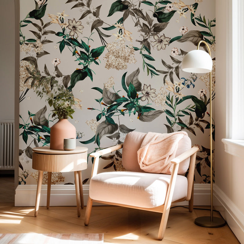 Modern living room with a floral wallpaper, pink armchair, side table, and floor lamp.
