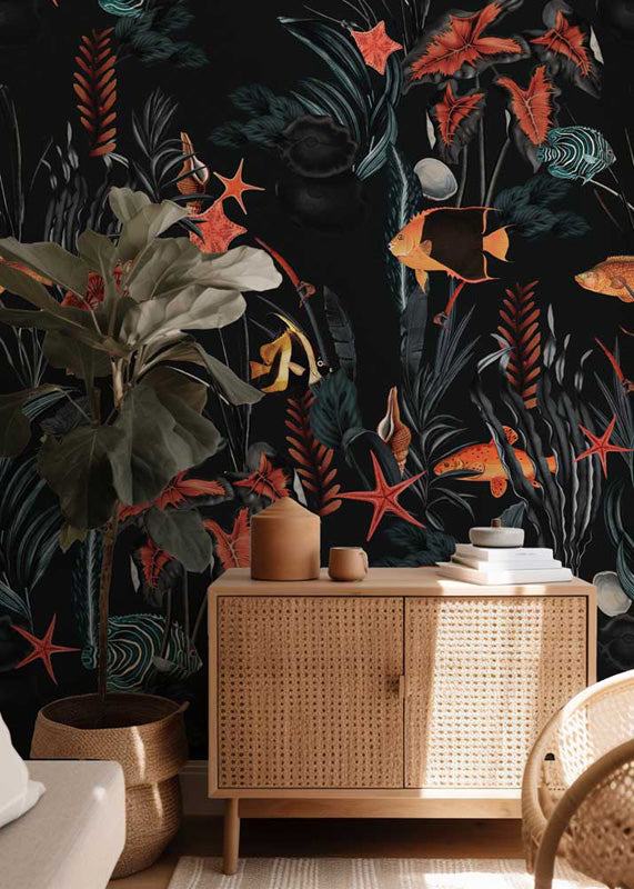 Maritime wallpaper with underwater scene, wicker cabinet, and plants in a room.