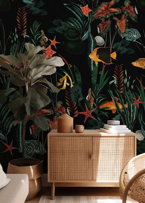 Room interior with wicker cabinet against a dark tropical wallpaper