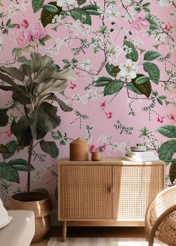 Room interior with floral wallpaper, wooden cabinet, and decorative items.